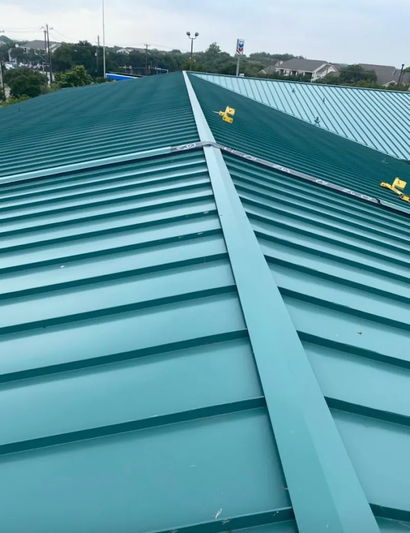 Green commercial metal roof ridge and valley for Metal Roof Repair in Farr West